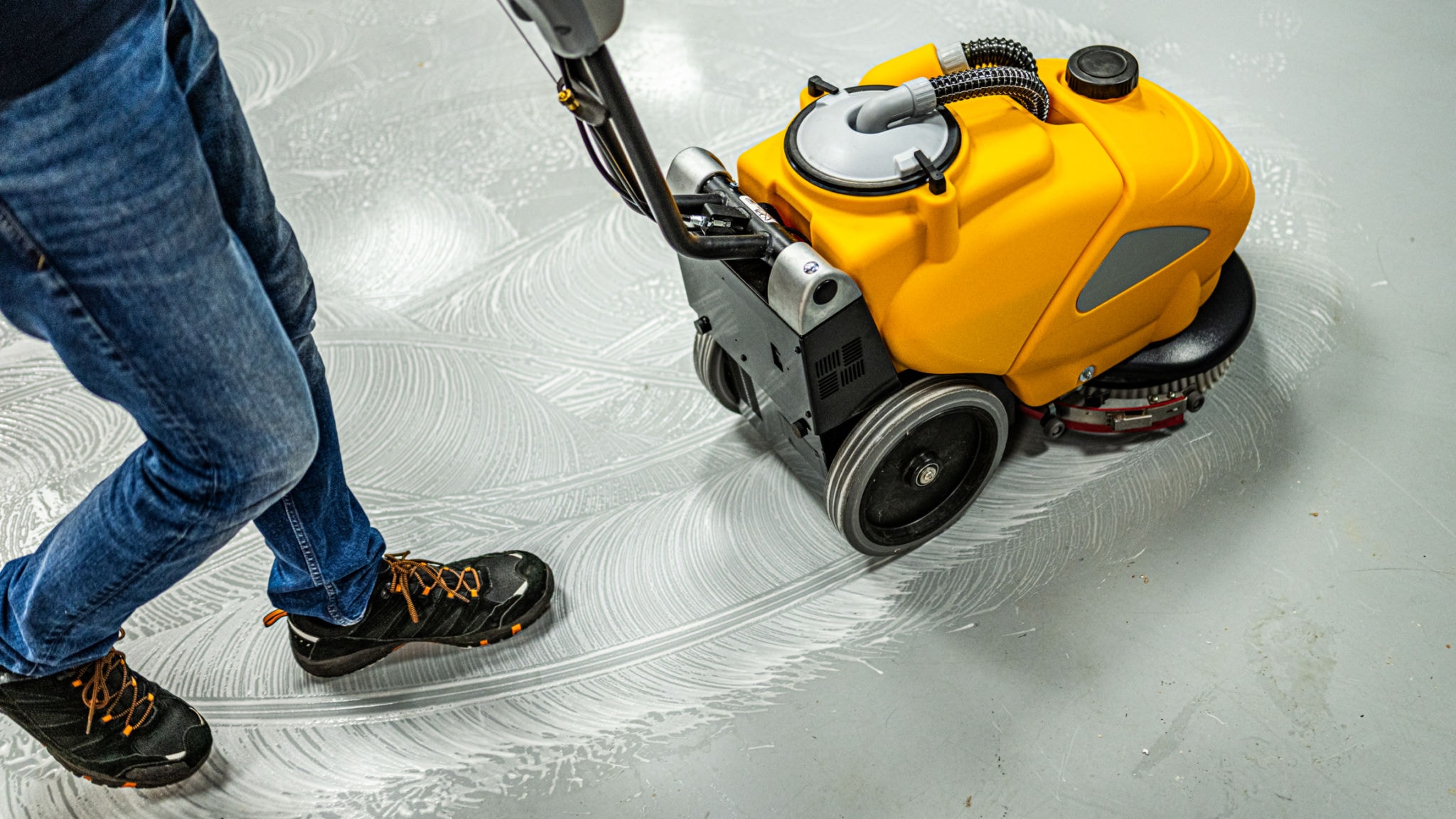 Professional floor scrubbing equipment in action